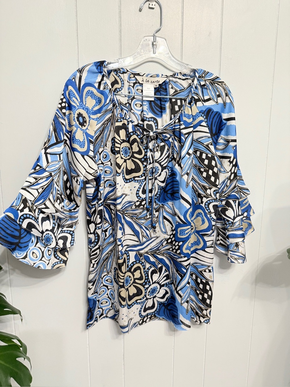 ##14)  A La Carte Blue Floral Tie-Neck Tunic with Bell Sleeves